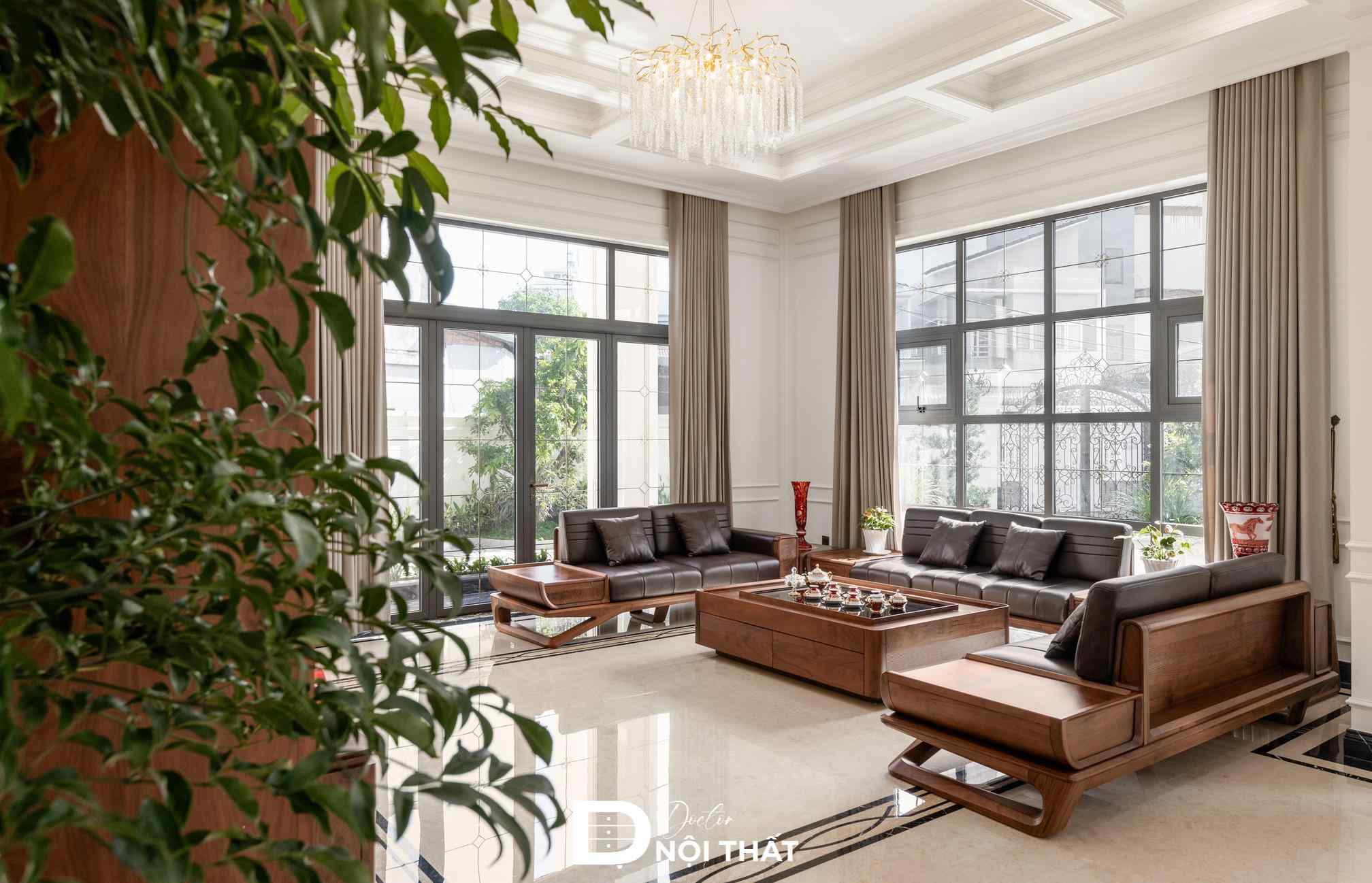 Bộ bàn ghế sofa gỗ óc chó trong khách thi công với kiểu dáng trơn đơn giản