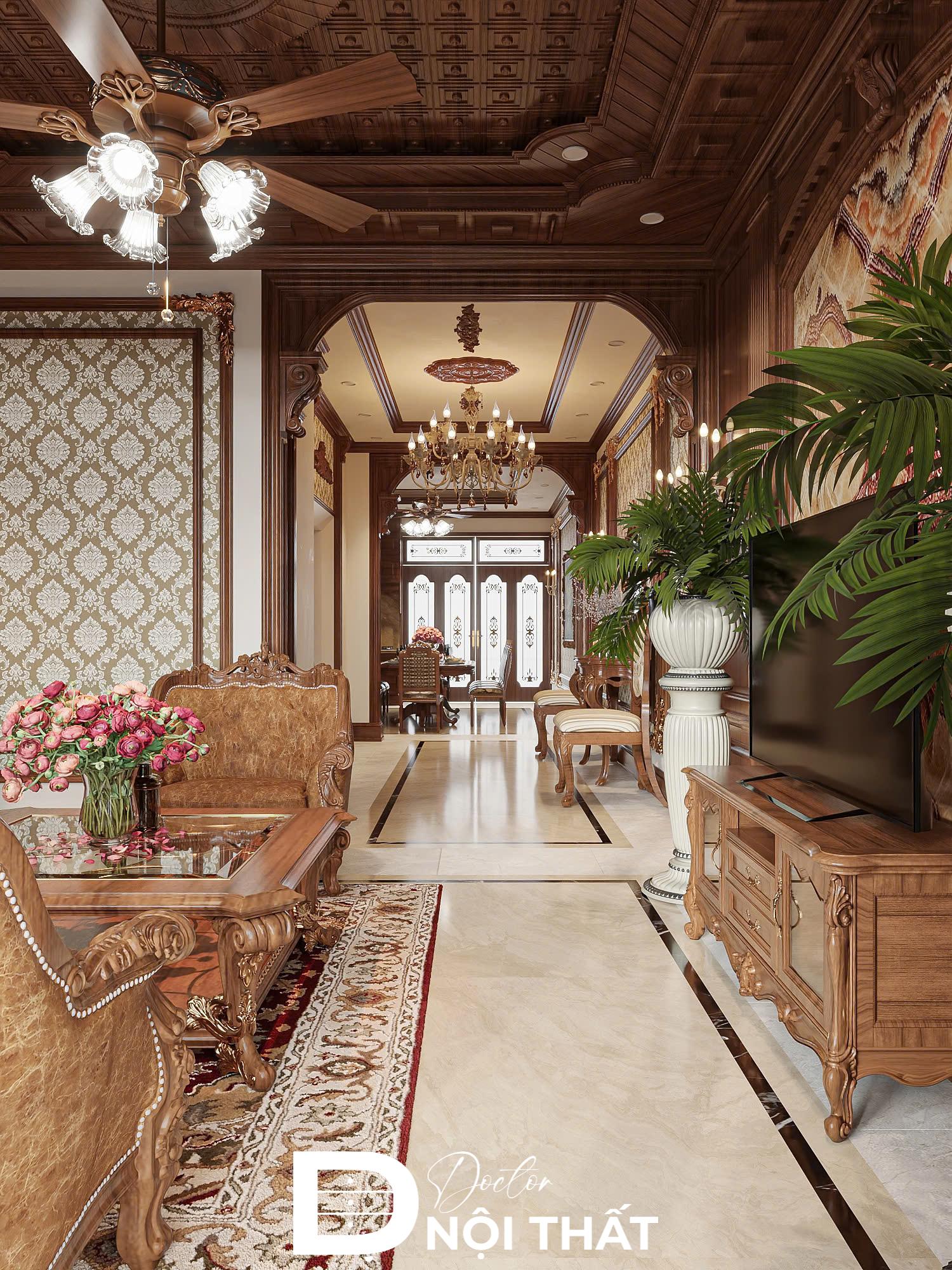 Phòng khách cổ điển thể hiện đẳng cấp gia chủ với bộ sofa gỗ chạm trổ tinh xảo và thảm trải sàn hoa văn