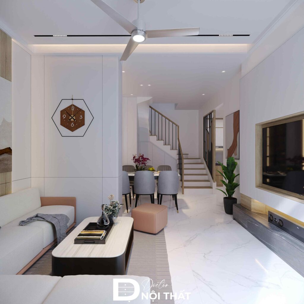 Phòng khách sáng thoáng với sofa chữ L, bàn trà bo góc và vách tivi ốp gỗ tinh tế
