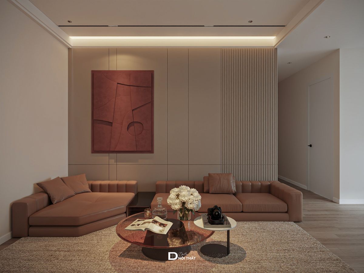 Mẫu thiết kế nội thất chung cư 94m² tại Vinaconex được Doctor Nội Thất triển khai cho gia đình anh Mạnh theo phong cách hiện đại, hướng đến không gian sống gọn gàng, ấm cúng và thuận tiện cho gia đình. Bảng màu be, kem và nâu được sử dụng xuyên suốt, kết hợp sàn gỗ cùng ánh sáng vàng nhẹ giúp căn hộ có cảm giác gần gũi nhưng vẫn giữ được nét hiện đại.Không gian phòng khách liên thông với khu bếp, sử dụng sofa góc lớn, bàn trà tròn và hệ vách TV tích hợp tủ lưu trữ. Ba phòng ngủ được xử lý theo nhu cầu riêng, trong đó bàn học, bàn làm việc và hệ tủ được bố trí sát tường để tận dụng diện tích. Đặc biệt, các phòng đều khai thác cửa sổ lớn nhằm tăng ánh sáng tự nhiên và tạo cảm giác thông thoáng.